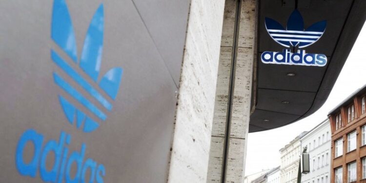 FILE PHOTO: An Adidas shop is seen, as the spread of coronavirus disease (COVID-19) continues in Berlin, Germany, March 30, 2020. REUTERS/Axel Schmidt (REUTERS/AXEL SCHMIDT)