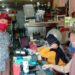 Ketua Pasar Besar Palangka Raya Hamidan (kiri) saat memberikan sosialisasi kepada para pedagang tentang bahaya COVID-19 dan pencegahannya hingga penerapan protokol kesehatan di Pasar Besar Palangka Raya. (ANT/IST)