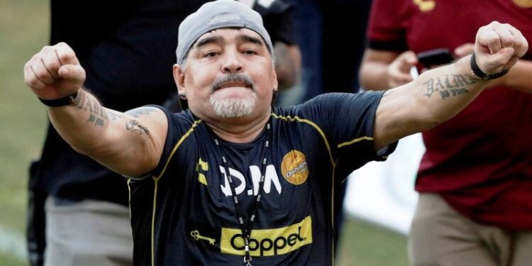 FILE PHOTO: Argentinian soccer legend Diego Armando Maradona reacts to fans during his first training session as coach of Dorados at the Banorte stadium in Culiacan, in the Mexican state of Sinaloa, Mexico September 10, 2018. REUTERS/Henry Romero/File Photo/File Photo/File Photo.