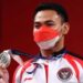 Lifter Indonesia Eko Yuli Irawan meraih medali perak pada nomor pertandingan putra 61kg Olimpiade Tokyo 2020 di Tokyo International Forum, Tokyo, Jepang, Minggu (25/7/2021). (REUTERS/Edgard Garrido/aa).
