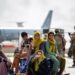 Pengungsi anak-anak menunggu penerbangan berikutnya setelah didaftarkan di Bandara Internasional Hamid Karzai, di Kabul, Afghanistan, Kamis (19/8/2021). (ANT/U.S. Marine Corps/Handout via Reuters)