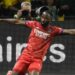 Penyerang Olympique Lyon Moussa Dembele merayakan golnya ke gawang Nantes dalam lanjutan Liga Prancis di Stadion Le Beaujoire, Nantes, Prancis, Jumat (27/8/2021) waktu setempat. (ANT/AFP/Sebastien Salom-Gomis)