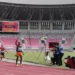 Pelari Abraham Elopere dari Papua finis pertama nomor 1500 meter putra T20 cabang atletik di Stadion Lukas Enembe, Kabupaten Jayapura, Papua, Sabtu (6/11/2021) (MASAPNEWS/ANT)