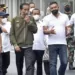 Presiden Joko Widodo (kedua kiri) bersama Menteri BUMN Erick Thohir (kiri) dan Dirut ITDC Abdulbar M Mansoer (kedua kanan) berjalan di area paddock Pertamina Mandalika International Street Circuit di KEK Mandalika, Praya, Lombok Tengah, NTB, Jumat (12/11/2021). (MASAPNEWS/ANT)