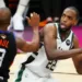 Arsip - Pebasket Milwaukee Bucks Khris Middleton (kanan) berupaya melewati penjagaan pebasket Phoenix Suns Chris Paul (kiri) dalam laga final gim kelima NBA, di Phoenix Suns Arena. Arizona, Amerika Serikat, Sabtu (17/7/2021). (MASAPNEWS/ANT/Reuters-Mark J. Rebilas -USA TODAY Sports)