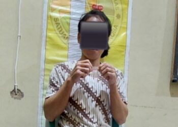 Tersangka AN (35) warga Kecamatan Sepang saat ditahan Satresnarkoba Polres Gumas. (IST)