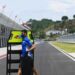 Kru Team Suzuki Ecstar membawa perlengkapan pit board menuju garasi pada hari terakhir tes pramusim MotoGP 2022 di Pertamina Mandalika International Street Circuit, Lombok Tengah, NTB, Minggu (13/2/2022). (MASAPNEWS/ANT)