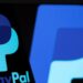 Arsip foto - Logo PayPal terlihat pada smartphone di depan logo yang sama yang diambil pada Rabu (8/9/2021). (MASAPNEWS/ANT/REUTERS)