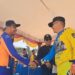 Ketua IMI Kabupaten Gunung Mas Evandi menyambut kedatangan Bupati Jaya S Monong di Sirkuit Antang Sakti Kuala Kurun, Minggu (20/8/2023). (IST)