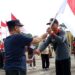 Suasana pencanangan Gerakan Pembagian Bendera Marah Putih di Kabupaten Gumas, Jumat (26/7/2024). (Foto : Diskominfosantik Gumas)